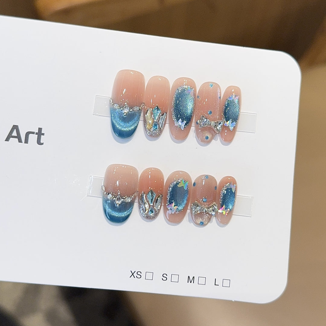 Artificial nail tips with glitter and watercolor effect Bowlift