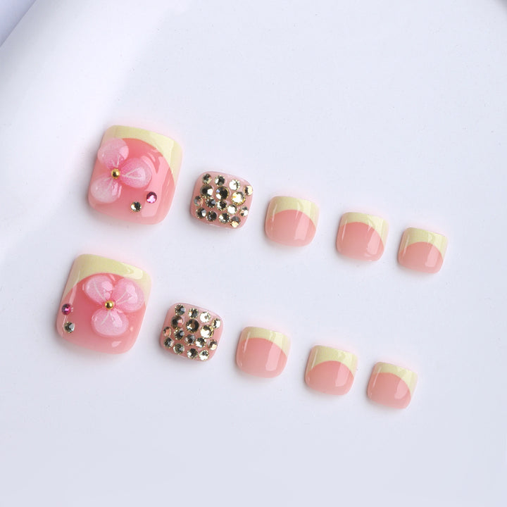 Artificial nail extensions with flower design and glitter accents Bowlift