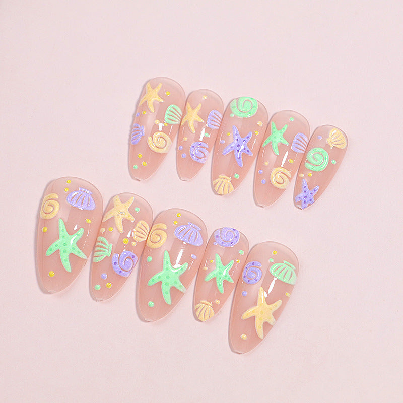 Artistic Press-On Nail Design with Ocean-Inspired Accents Bowlift