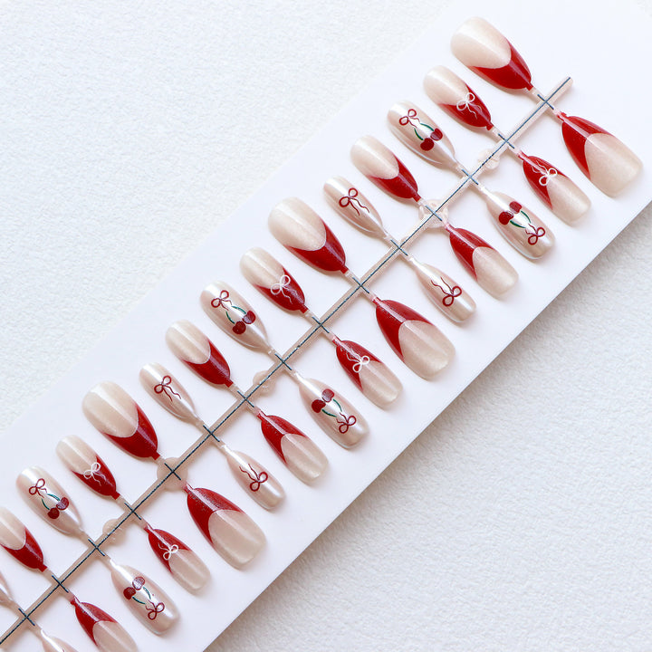 Artistic Press-On Nail Set with Cherry and Ribbon Design Bowlift
