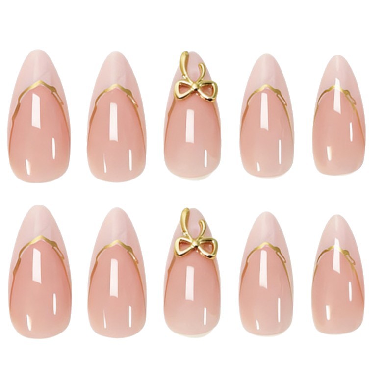 Artificial nails with elegant tip decorations and golden accents Bowlift