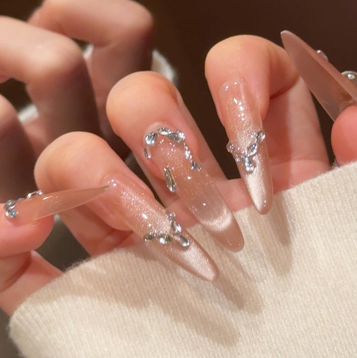 Artistic Stiletto Press-On Nail Art with Glimmering Accents Bowlift