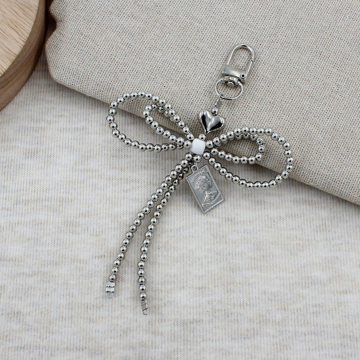 Elegant Beaded Bow Brooch Bowlift