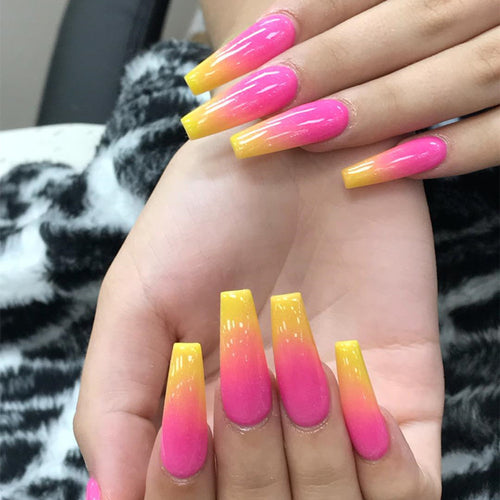 Artificial nail tips in modern ombre design Bowlift