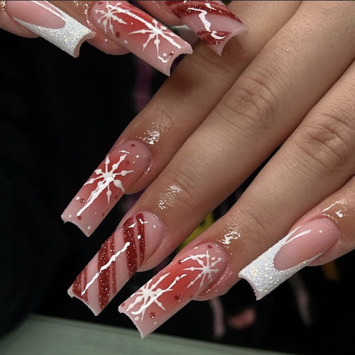 Acrylic nail set with festive candy cane and glitter accents Bowlift