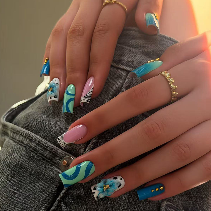 Artificial fingernails with handcrafted designs Bowlift