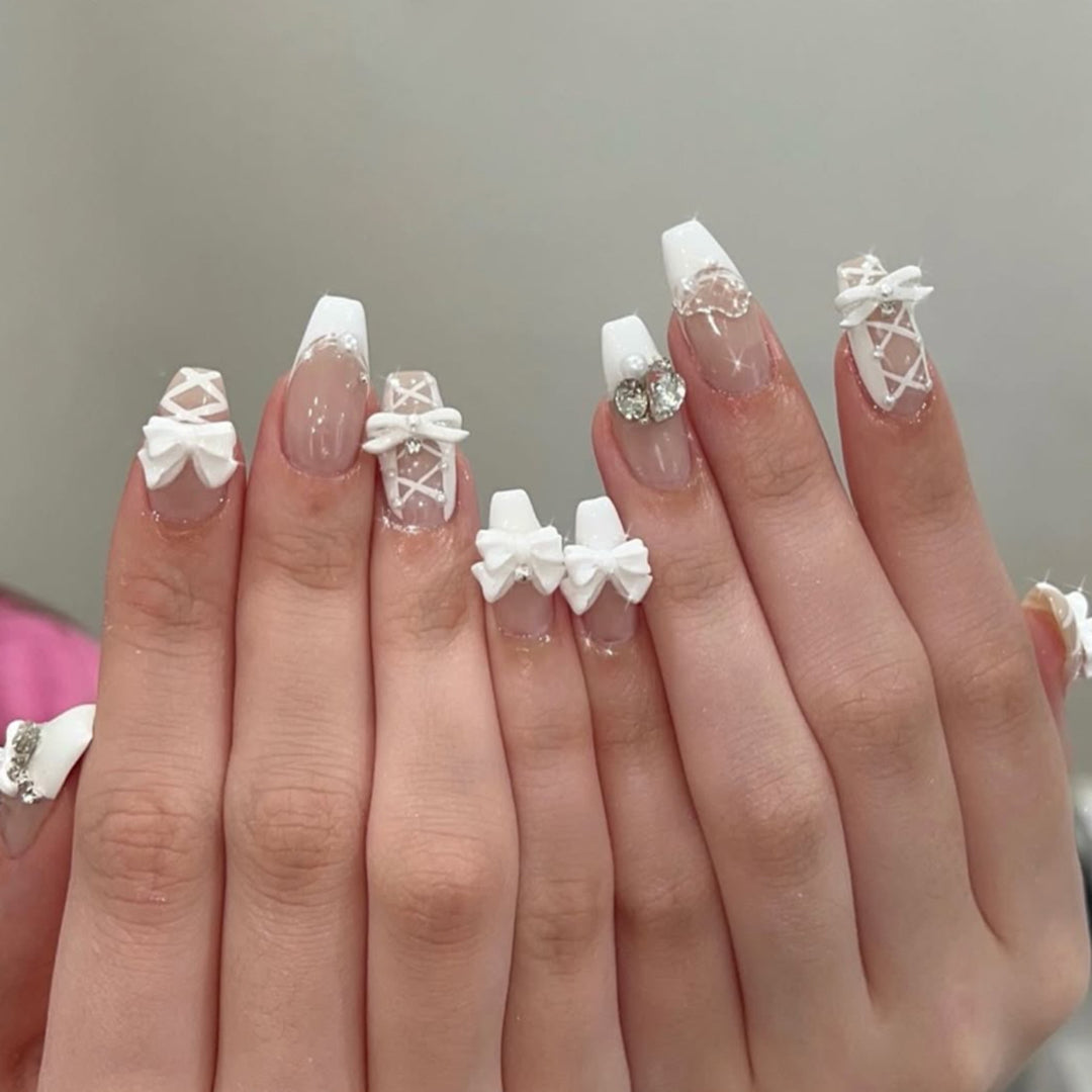 Artful Nail Art with Bows and Rhinestone Decorations Bowlift