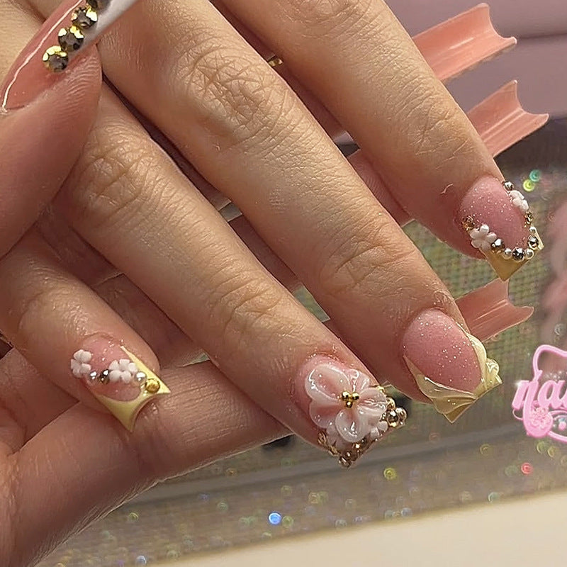 Nail art set with glamorous glitter and flower accents Bowlift