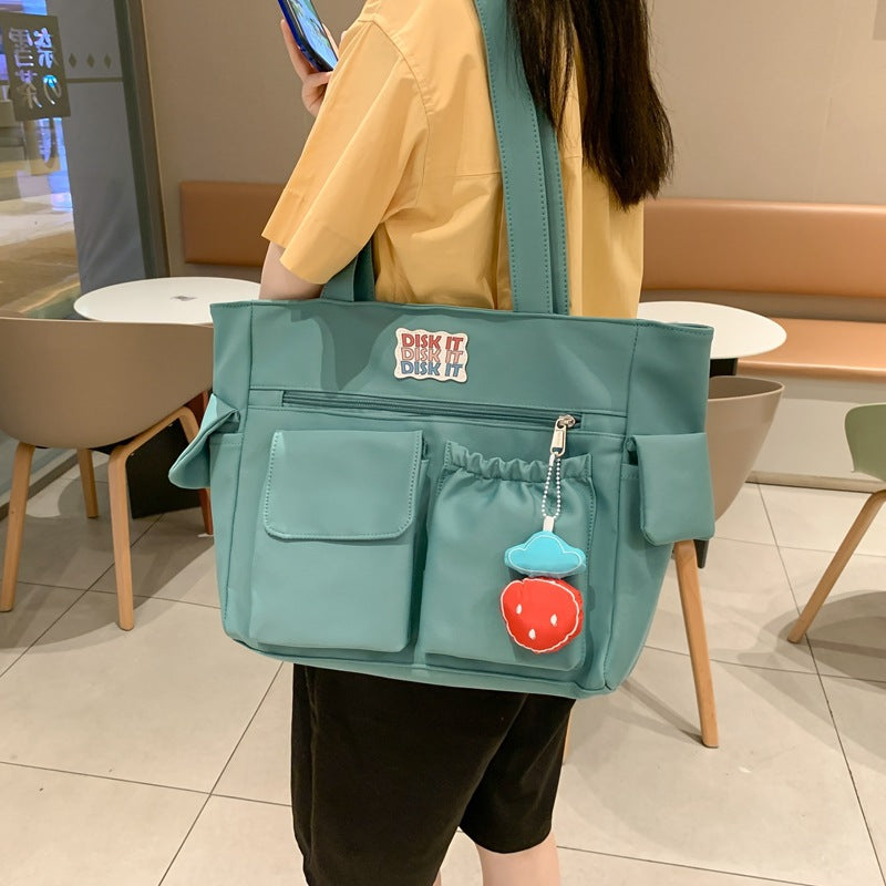 Tote bag with versatile compartments and ergonomic design Bowlift
