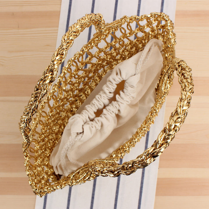 Shoulder bag made of punched metal grid Bowlift