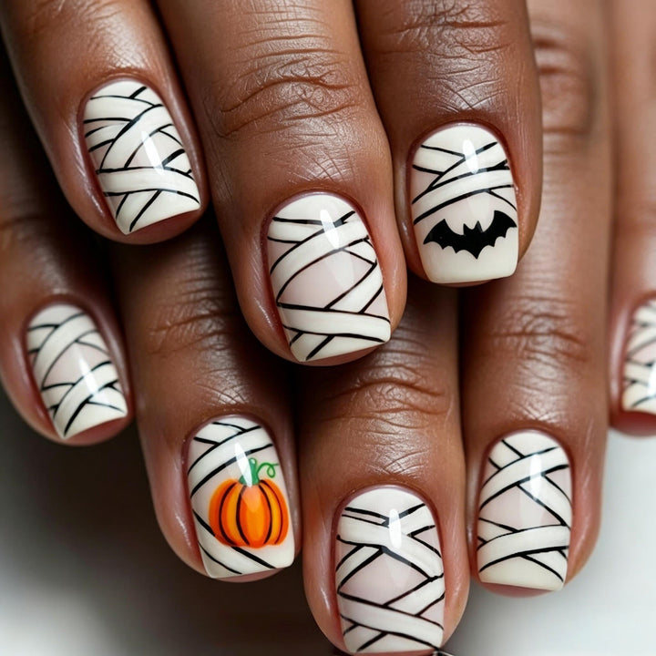 Creative Halloween Nail Art with Pumpkin and Bat Design Bowlift