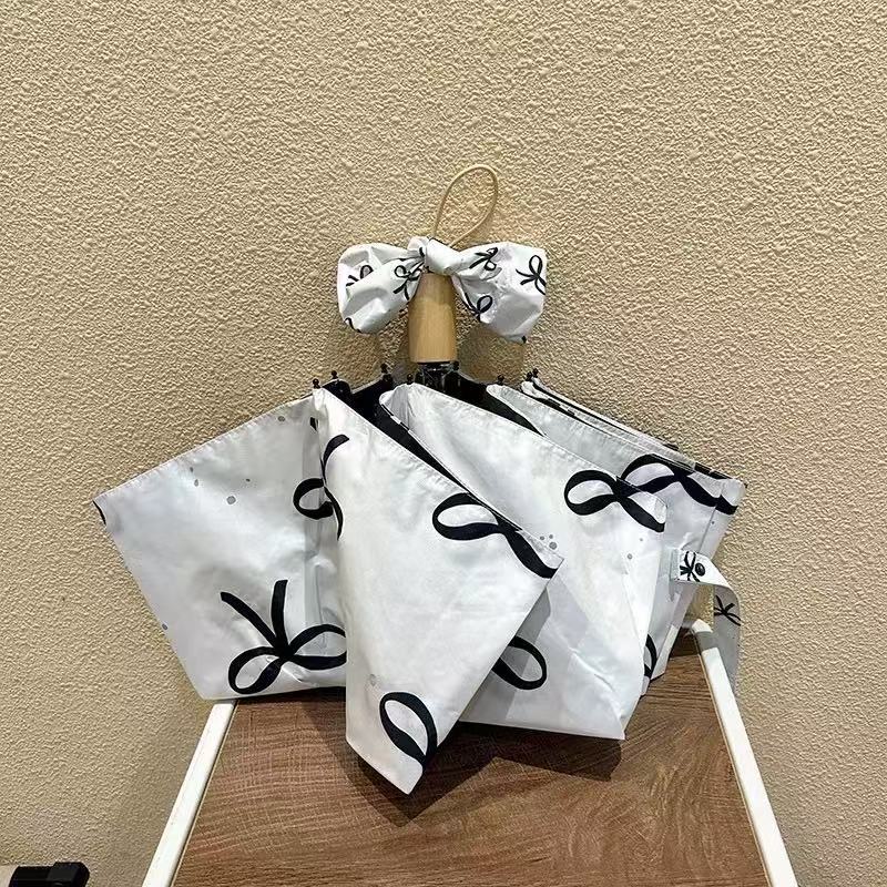 Women's foldable umbrella with elegant bow design Bowlift