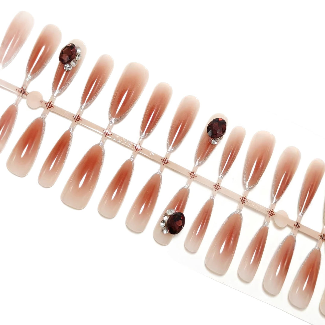 Glamorous artificial nails in elegant ombre style with rhinestone embellishments Bowlift
