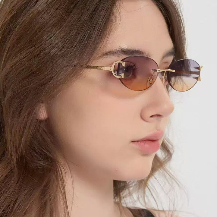 Women's elegant oval-shaped sunglasses with fashionable metal frame Bowlift