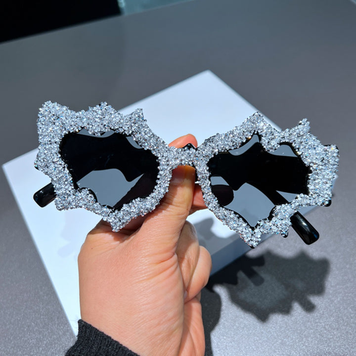 Ladies creative sunglasses in an extravagant design with glitter embellishments Bowlift