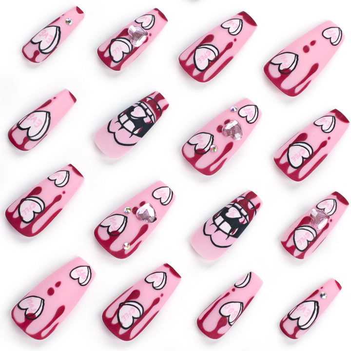 Artful stiletto nails with hearts and glitter accents Bowlift
