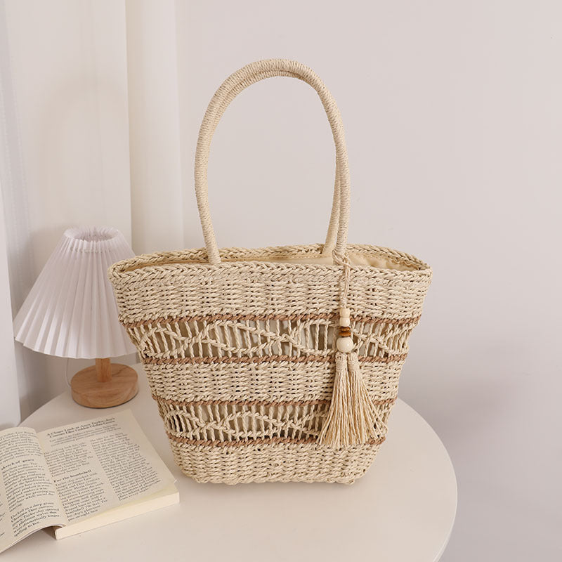 Handcrafted straw tote bag with decorative tassel detail Bowlift