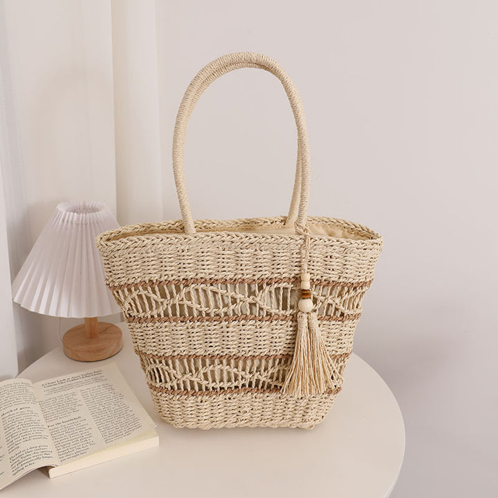 Handcrafted straw tote bag with decorative tassel detail Bowlift