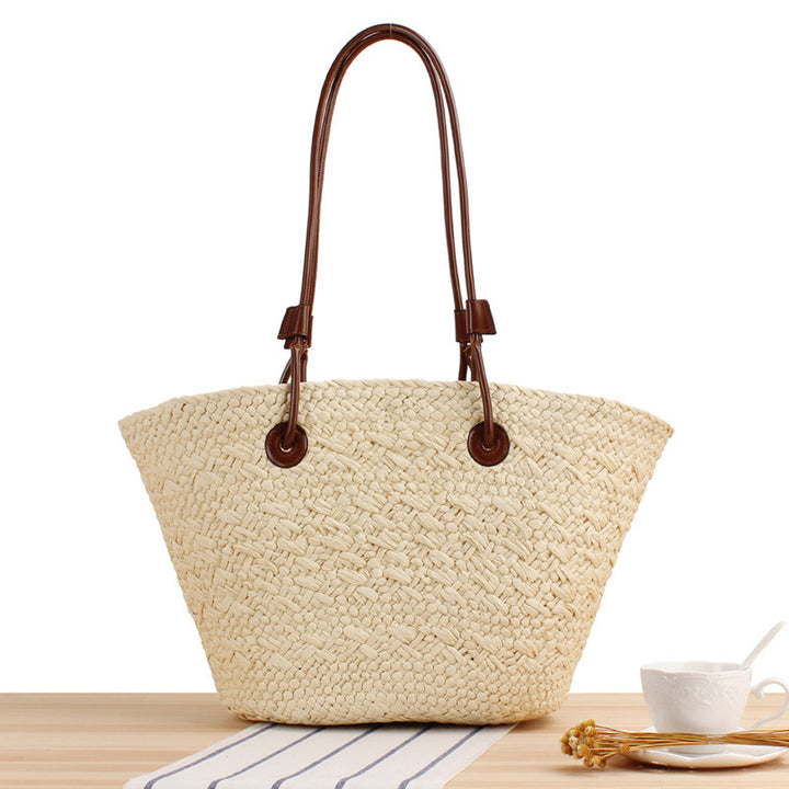 Beach bag made of high-quality braided straw with stylish leather handles Bowlift