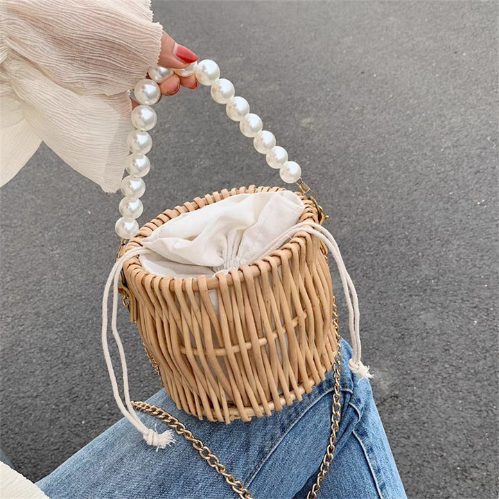 Women’s handbag with elegant pearl handle and braided design Bowlift