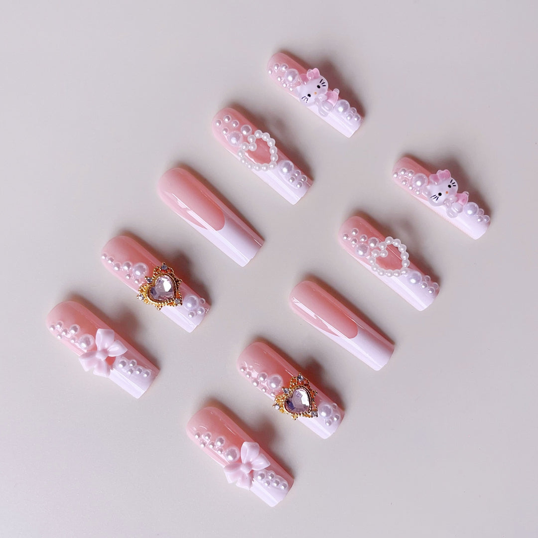 Glamorous artificial nails with 3D decorations and pearl accents Bowlift