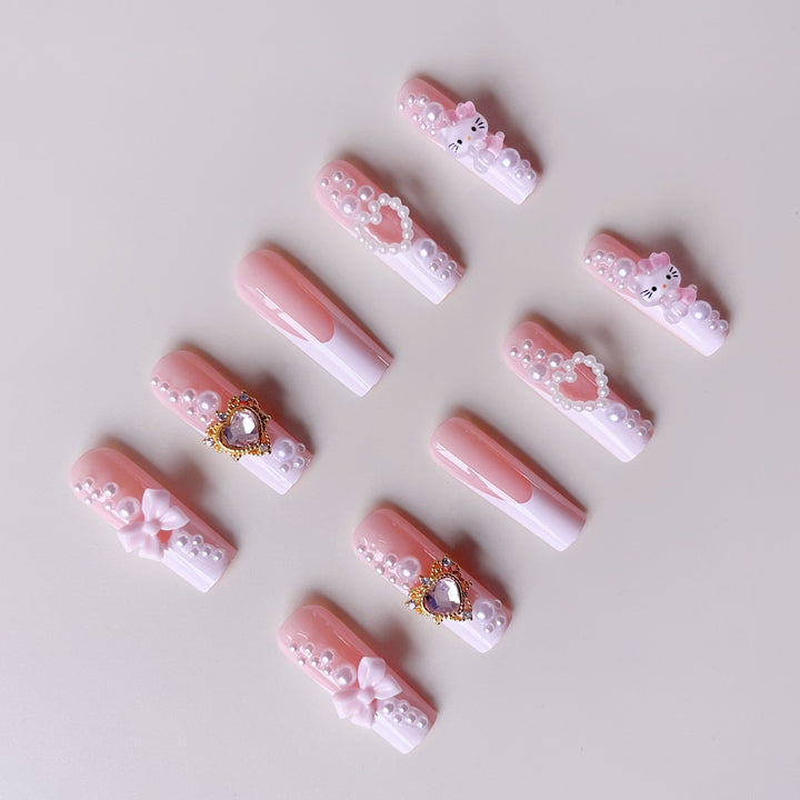 Glamorous artificial nails with 3D decorations and pearl accents Bowlift
