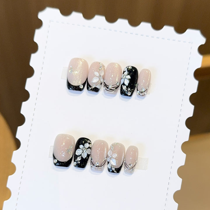 Exclusive artificial nails with floral accents and glitter coating Bowlift