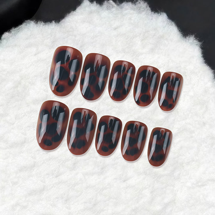 Glossy Stiletto Nail Tips with Leopard Print Design Bowlift