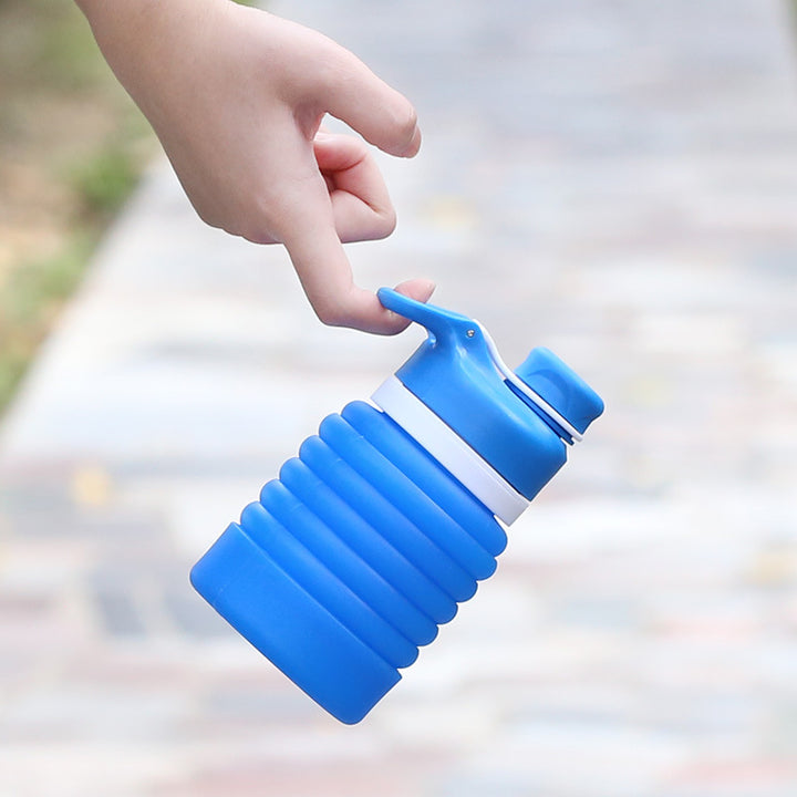 Collapsible silicone water bottle with ergonomic ribbed grip and flip-top spout Bowlift