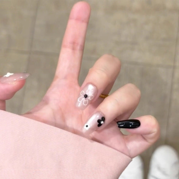 Artistic Press-On Nail Set with Floral and Speckled Design Bowlift