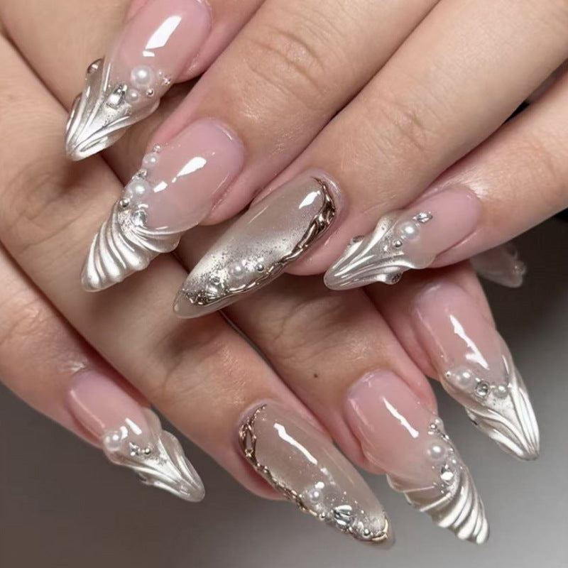 Elegant nail art in maritime design with glitter and 3D accents Bowlift