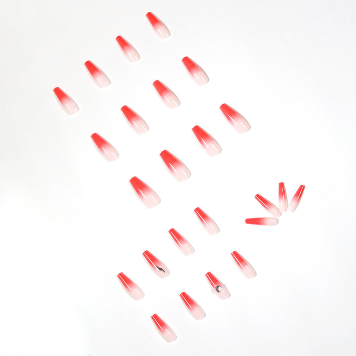 Artful stiletto nails with elegant gradient and rhinestone embellishment Bowlift