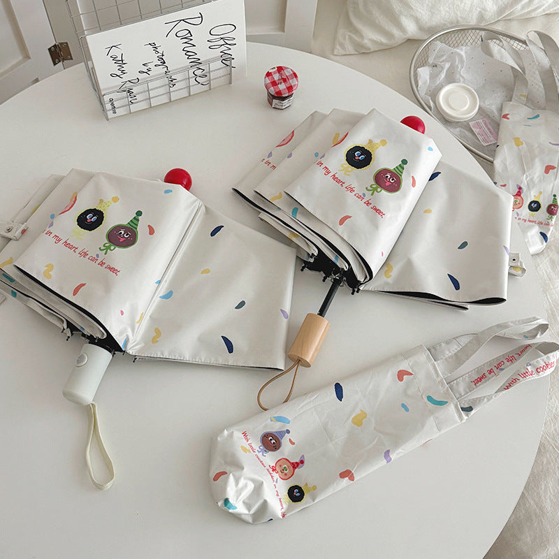 Women Folding Umbrella with Playful Cartoon Designs Bowlift