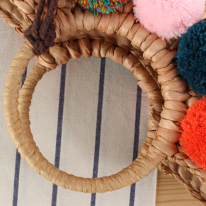 Basket bag with colorful pompons and carrying straps Bowlift