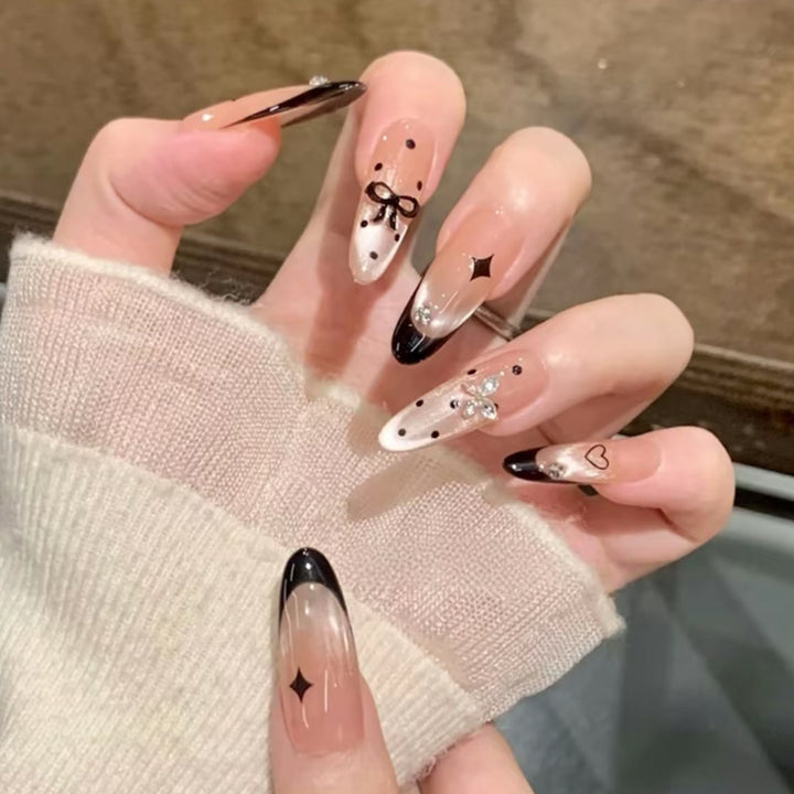 Glamorous artificial nails with creative embellishments Bowlift