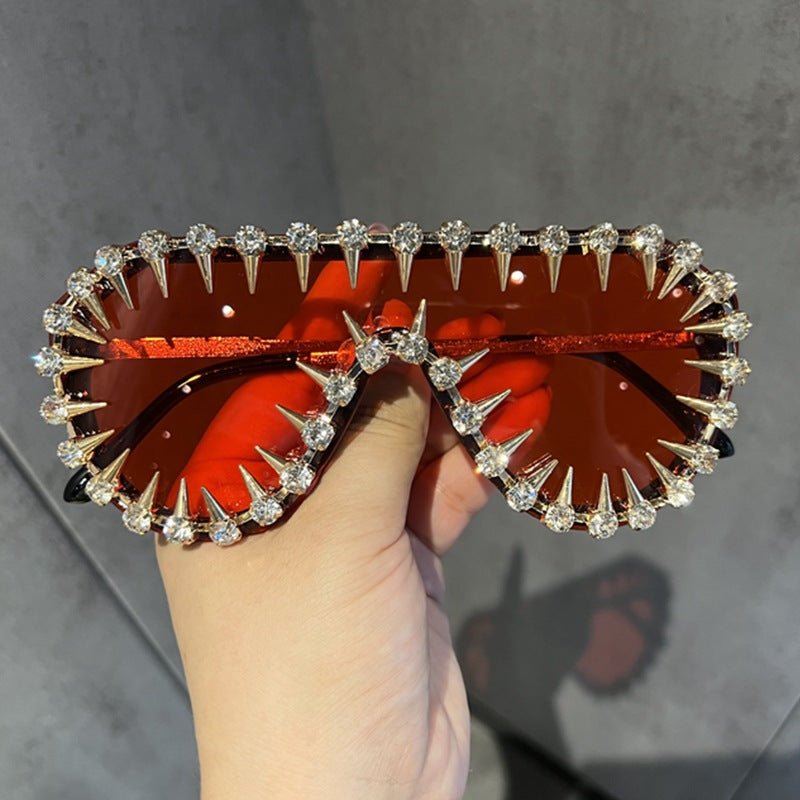 Ladies extravagantly designed cat-eye sunglasses with glitter accents Bowlift