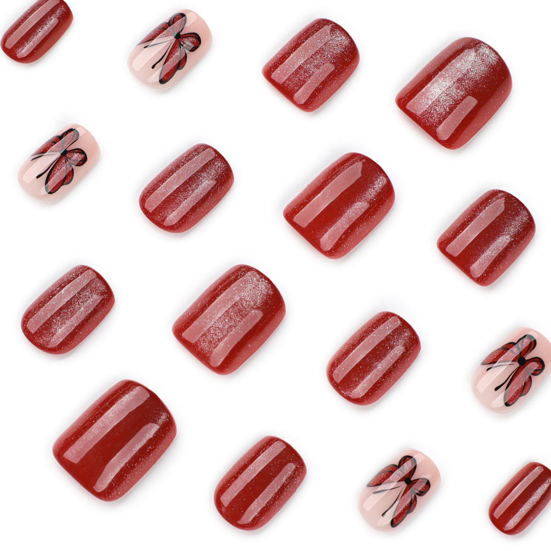 Artistic nail design with butterfly motifs Bowlift