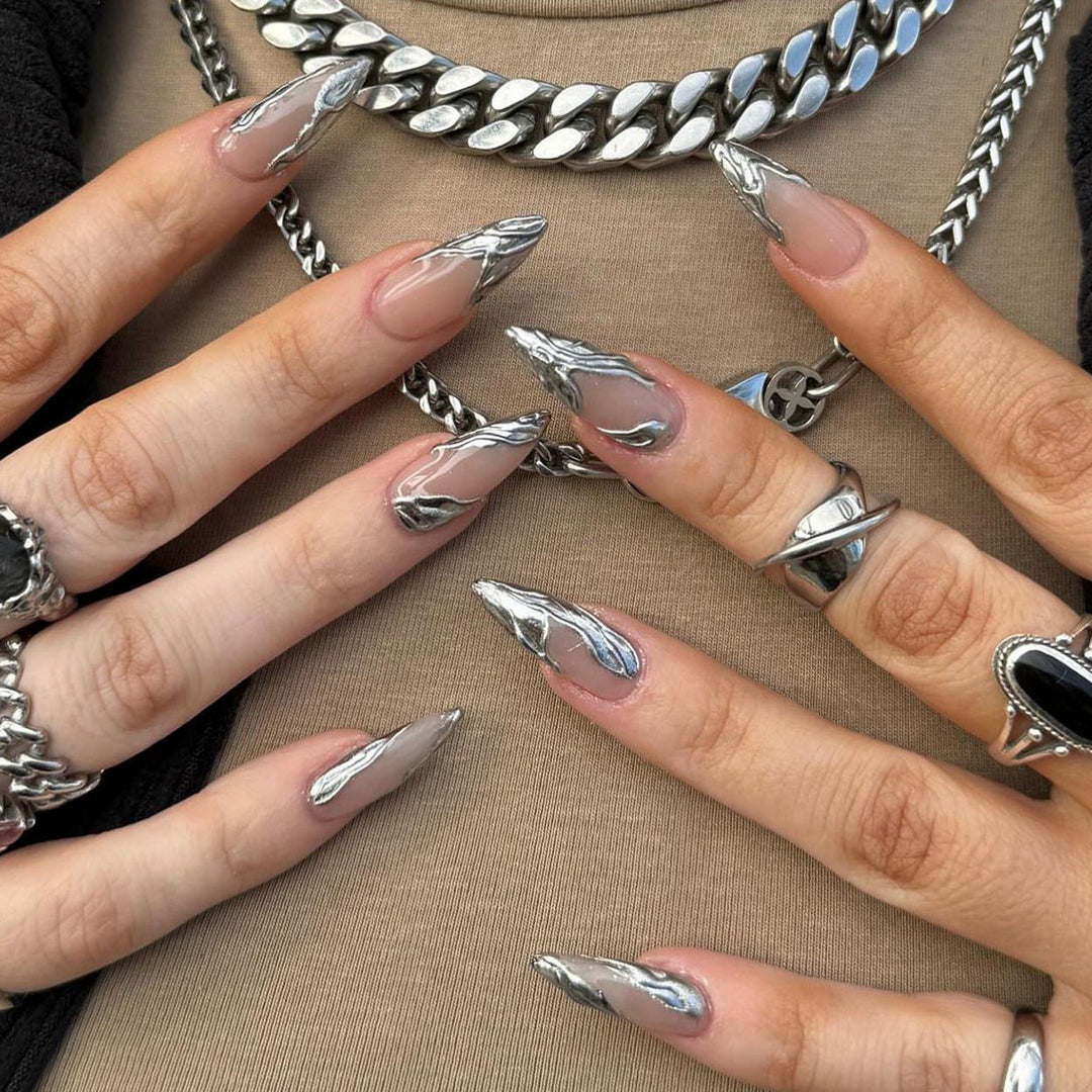Artistic Acrylic Stiletto Nails with Elegant Metallic Decorations Bowlift