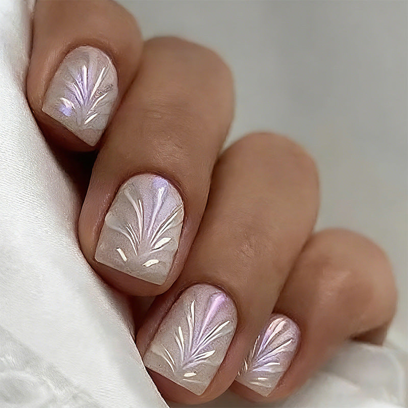 Acrylic nail set with elegant pearl details and fine floral patterns Bowlift