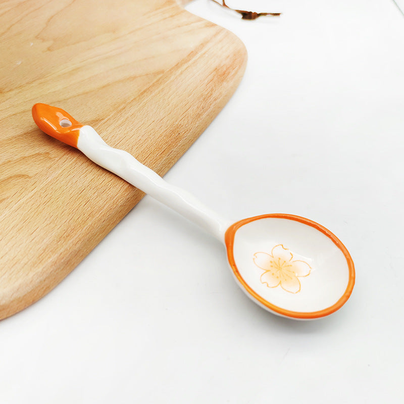 Ceramic soup spoon with lucky cat illustration and ergonomic long-handle Bowlift