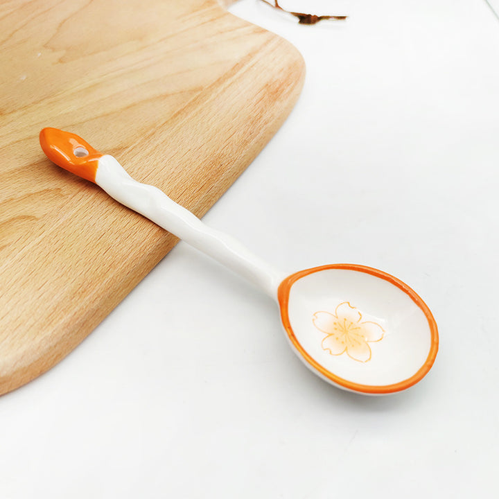 Ceramic soup spoon with lucky cat illustration and ergonomic long-handle Bowlift