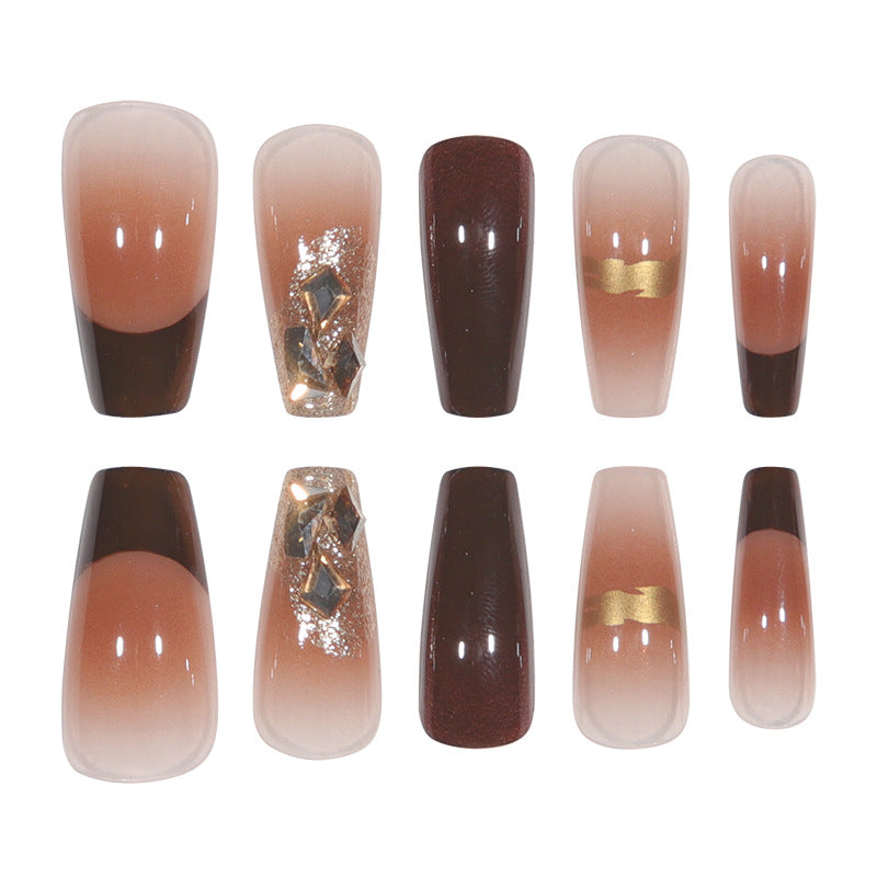 Elegant Long Press-On Nails with Decorative Gold Accents Bowlift