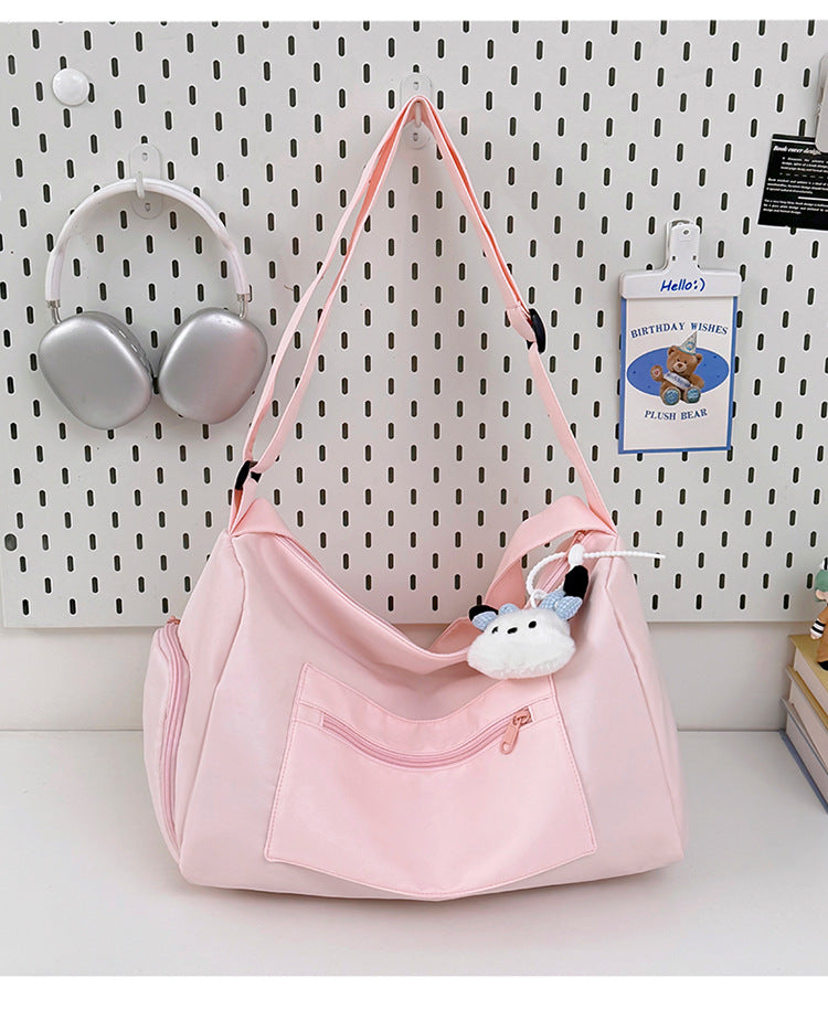 Sporty shoulder bag with spacious interior and sturdy carrying strap Bowlift