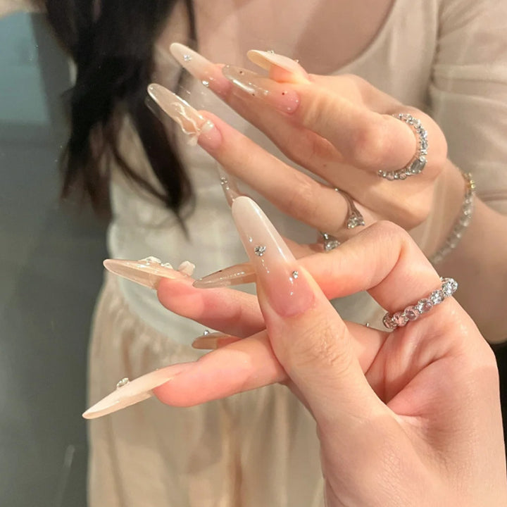 Elegant Stiletto Press-On Nails with Decorative Bow and Rhinestone Accents Bowlift