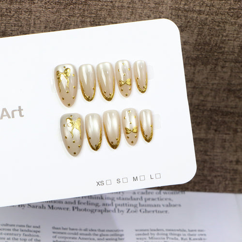 Elegant Press-On Nail Art with Golden Bow Accents Bowlift