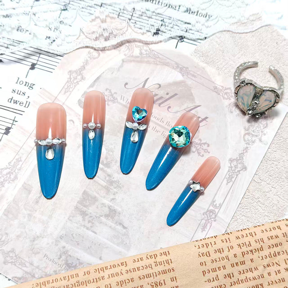 Glamorous artificial nails with rhinestone applications Bowlift