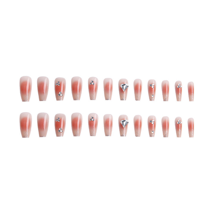Acrylic nail set with elegant heart and rhinestone decorations Bowlift