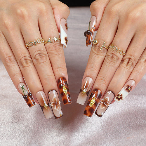 Elegant nail art set with floral and golden accents Bowlift