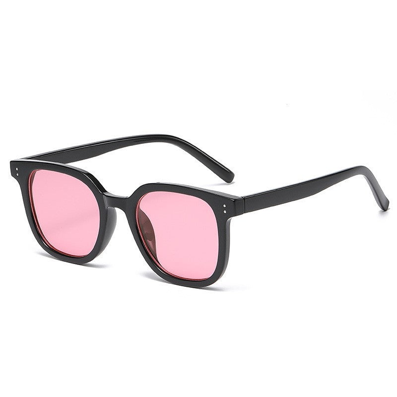Women striking retro sunglasses with yellow-tinted lenses Bowlift