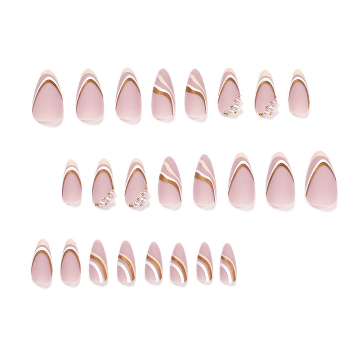Artful stiletto nails with elegant gold and white accents Bowlift